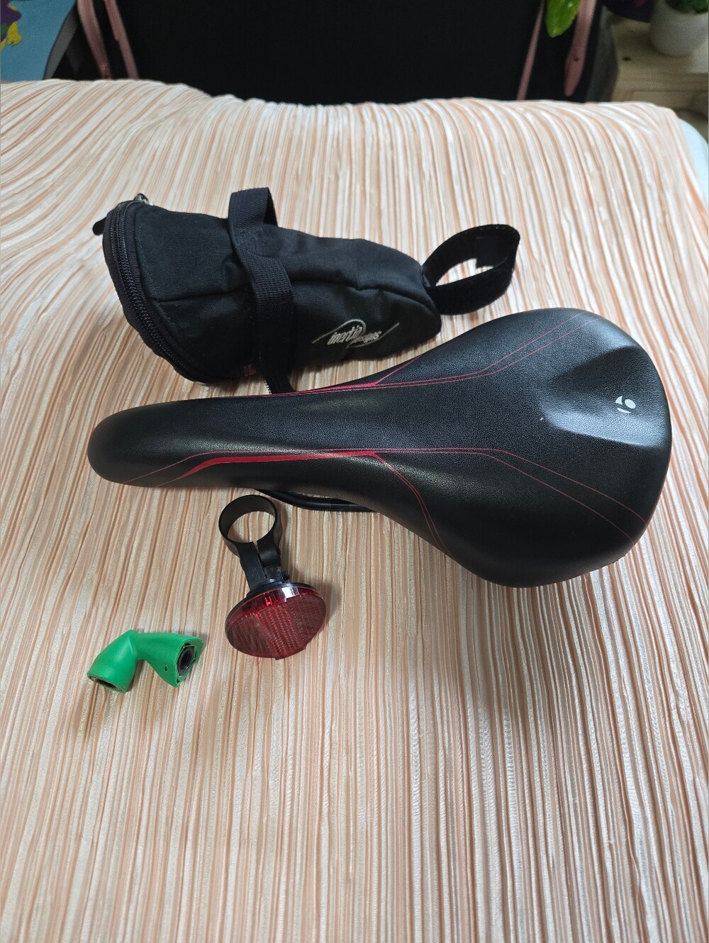 Bontrager Black Bike Saddle with Red Accents and Rear Light